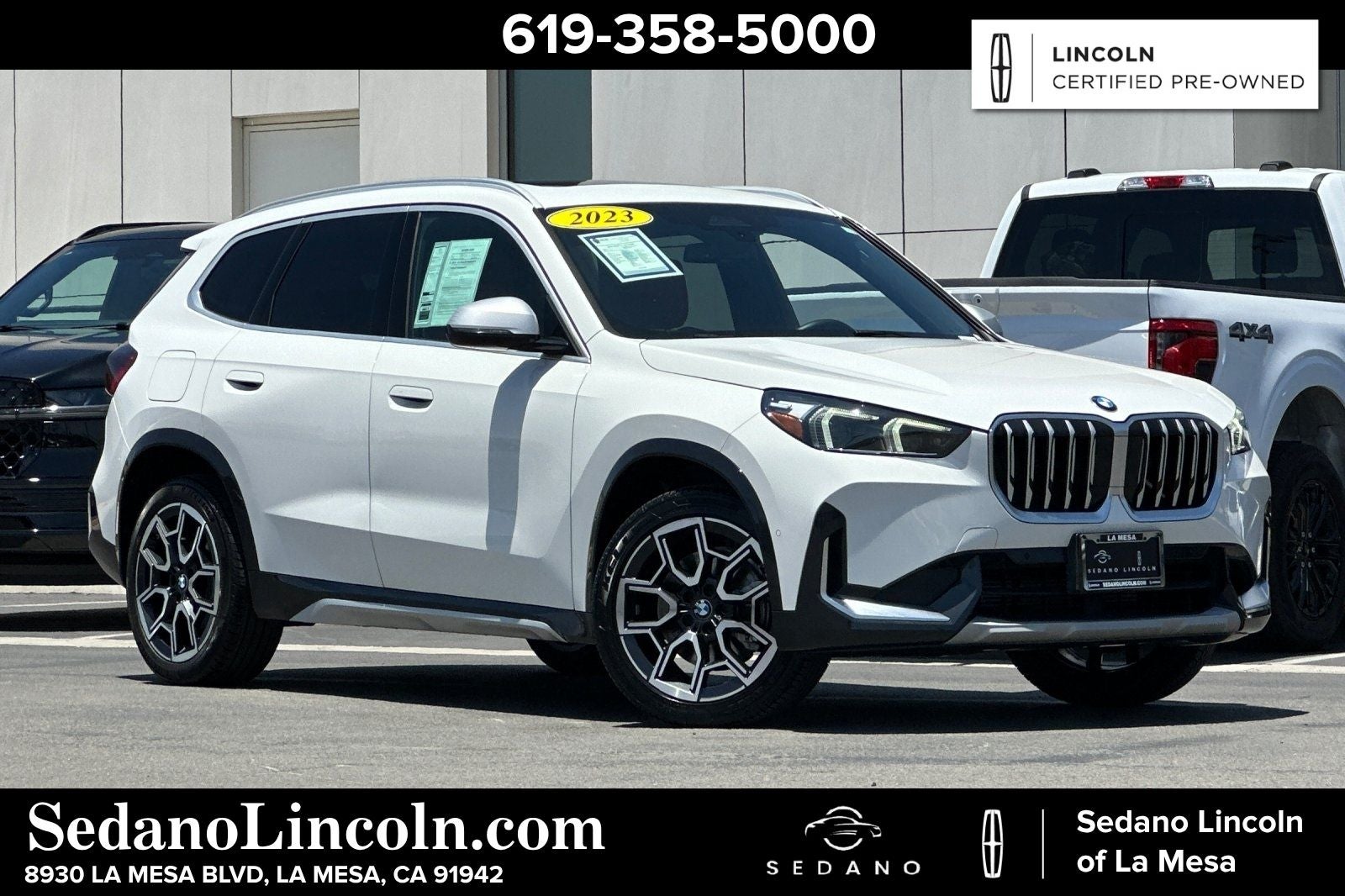 2023 BMW X1 xDrive28i in Alpine White — front three-quarter view