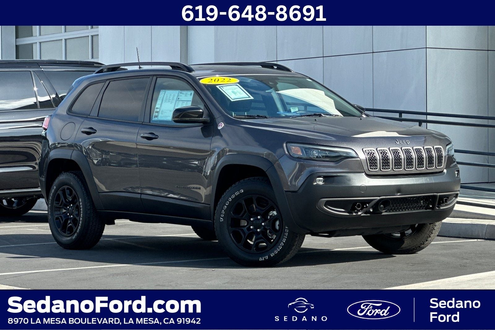2022 Jeep Cherokee Trailhawk in Granite Crystal Metallic Clearcoat — front three-quarter view